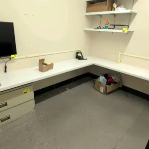Laminate L-shaped countertop. Features a white finish. 132" x 106". Wall-mounted. Contents and cabinets not included.