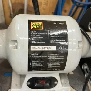 Bench grinder in stand