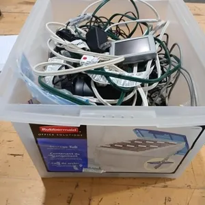 Plastic storage bin with assorted cord & cables