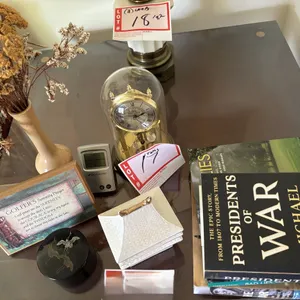 Books, anniversary clock, Japanese coasters, and stackable