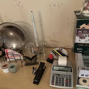 Items on top of buffet, adding machines, tapes, knickknacks