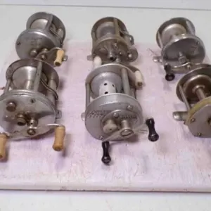 6 Baitcasting Fishing Reels Zip Tied to Display