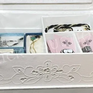 misc costume jewelry in white jewelry box