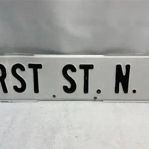 Embossed First St North West Street Sign