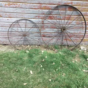 2 large iron wheels