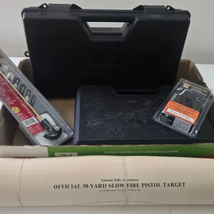 2 hard pistol cases, a pistol cleaning kit, and snake