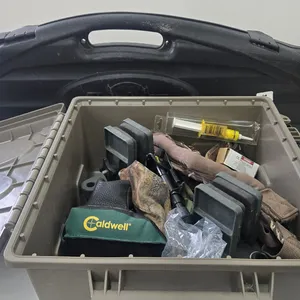 Selection of shooting supplies including gun vise, gun rests, rifle sling, ammo belt and pouch all i