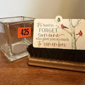 Candle holder, memory ornament, brush