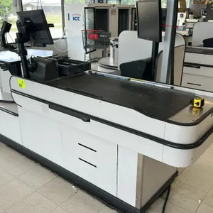 Accent LHTA 10'L laminate check lane. Features a 4'L conveyor belt and a rotating carousel bagger stand. Built with light gray laminate and black prot