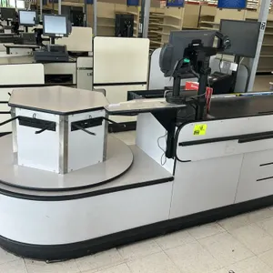 Accent LHTA checkout lane. Features laminate construction with a grey finish and black trim, a 4' motorized conveyor belt, and a rotating hexagonal ba