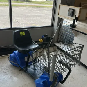 Mart Cart XTi 12 electric shopping cart. Features a blue plastic body, front wire basket, black vinyl seat, and handlebar controls with battery level 