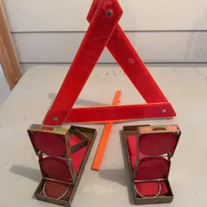 One reflective warning triangle and two vintage metal road flares with red reflective panels. Suitab