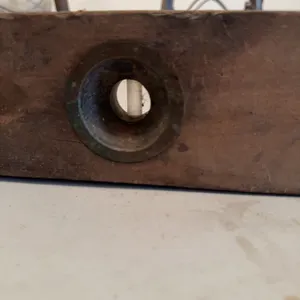 Wooden carpenter's level with brass fittings and inset bubble vial, featuring two viewing windows. T