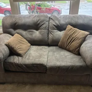 Loveseat with Two Brown Throw Pillows