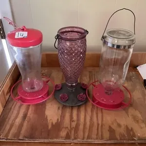 3 hummingbird feeders one with no lid