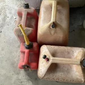 4 gas cans. One broken nozzle