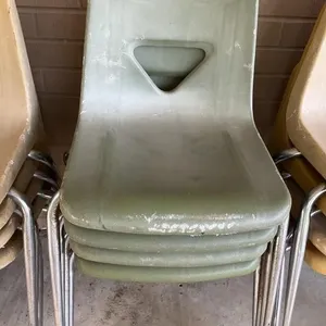 4 green hard plastic chairs