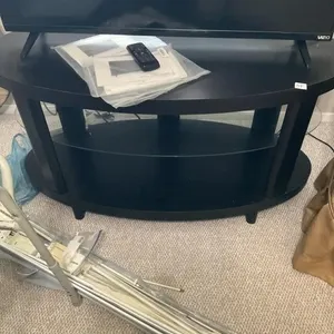 Oval black tv stand with glass shelf. 45L. TV
