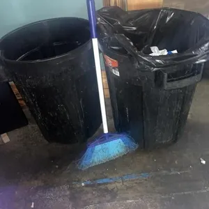 2 libman 32 gal Trash cans and broom
