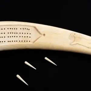 WALRUS TUSK CARVED CRIBBAGE BOARD W/ 3 PEGS