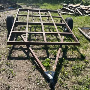 OFFSITE - Utility trailer frame with approximately 3500 pound axle, 2” tongue, tires in good shape. Trailer frame is 74” x 124”. 1 tire new and 1 used