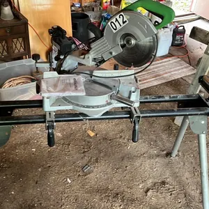 OFFSITE - Evelution Sliding compound mitre saw. Sides extend to 9.5 feet. Manual included.