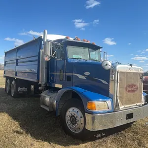 1995 Peterbuilt tandem twin screw grain truck, 375 Conventional, equipped with 2010  21’ Load Line box and hoist, swing out gate, roll tarp, rear cont