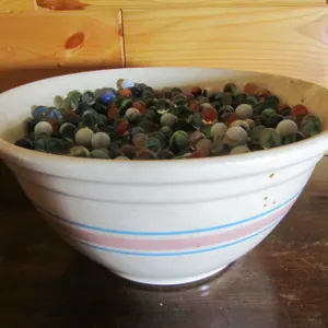 Stoneware Bowl Full Of Assorted Marbles