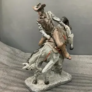 RESIN COWBOY ON BUCKING HORSE