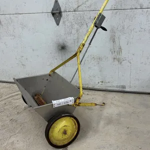Walk-Behind Manual Drop Spreader with Galvanized Steel Hopper and Yellow Frame