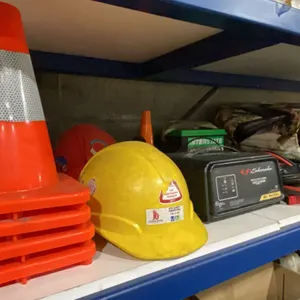 SHELF OF ASSORTED ITEMS- BATTERY CHARGER, PYLONS, RATCHET STRAPS, JUMPER CABLES, LEAF BLOWER