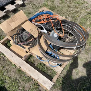 Pallet of misc cords, baler control for New Idea, bandsaw blades etc