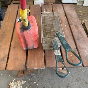 OFFSITE - nice wooden 3 ft by 3 ft table , 2 new frying baskets and a Jerry can all one lot
