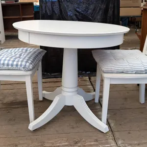 Round White Table with Two Chairs and Cushions