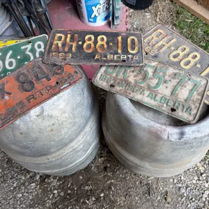 Vintage License Plates with Two Antique Beer Kegs