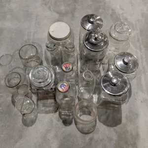 Lot of Vintage Glass jars, milk jugs, and etc.