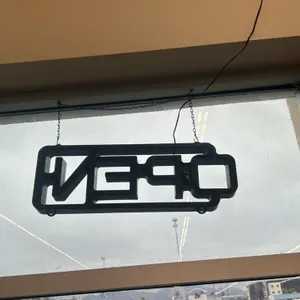 LED "OPEN" sign. Features a black frame and hanging chain. Includes integrated power cord. Mounted via hanging chain.