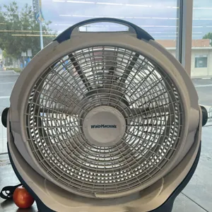 WindMachine poly floor fan. Features a durable plastic construction with a gray and blue finish, integrated carrying handle, and a tilting fan head to