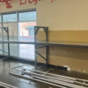Metal teardrop warehouse racking. Features a gray finish and solid shelf decking. 96"W x 37"D x 73"H. Note: items stored underneath are not included.