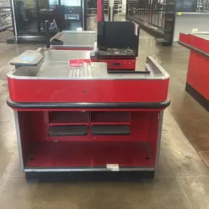 Royston UL-6-55-RH-1 single belt checkout lane. Features metal construction with a red finish, stainless steel work surfaces, lower storage shelves, a
