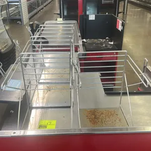 Metal grocery bag stand. Features wire frame construction designed for holding plastic T-shirt style bags and a flat metal base. Note: exhibits heavy 