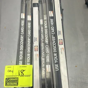 Grocery checkout lane divider. Features clear plastic construction with credit card advertisement inserts, including Discover, Visa, and Mastercard gr