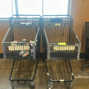 Metal grocery cart. Features black wire basket, folding child seat, and lower storage rack. Mounted on casters. Contents not included.