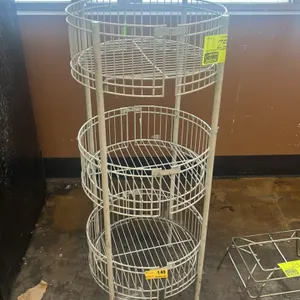 Metal multi-tier merchandiser. Features a 3-tier white wire basket design. 18" x 45".