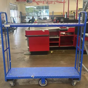 Metal 2-tier U-boat utility cart. Features a blue finish, diamond plate bottom deck, and solid upper shelf. 5'L. Mounted on 6 casters.