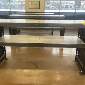 Metal teardrop shelving unit. Features a 2-tier design with solid metal decking, gray step beams, and a black teardrop frame with solid side panels. 9