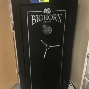 Bighorn Classic Series gun safe. Features a black finish, SecuRam electronic keypad lock, and a 3-spoke handle. Combination is provided. Note: Safe on