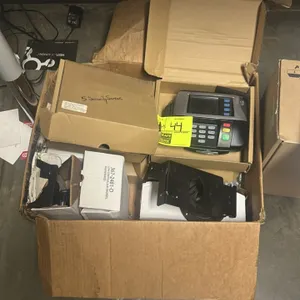 Verifone credit card terminal. Features digital screen, physical keypad, and card reader. Includes black ENS mounting stand (Model 367-1417-BB-A).