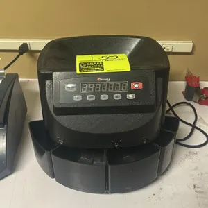 Cassida C200 coin counter and sorter. Features a top-loading hopper, digital display, push-button control panel, and 5 coin sorting bins. Includes pow