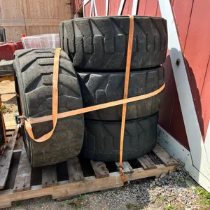 (4) Titan Ultimate Tires with Rims for Skid Loader